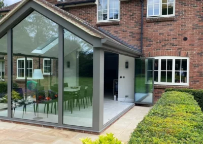 Modern sliding glass doors of bifold type fully open