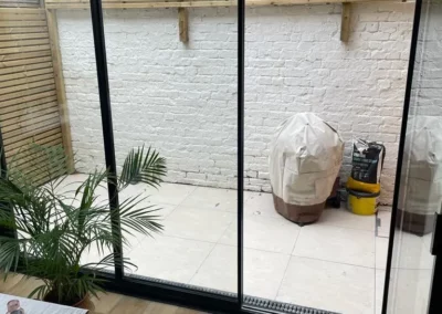 Ultra thin bifolding doors forming a glass wall