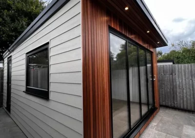 Ultra slim bifolding doors by a patio. Wooden home, UK