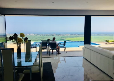 ultra slim sliding doors installation by a pool and sea