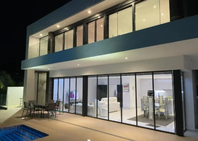 slimline bifold doors doors installation by a pool at night