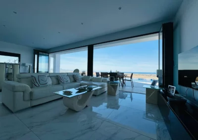 ultra slim sliding doors installation by a pool and sea