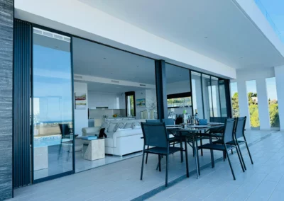 ultra slim sliding doors installation by a pool and sea