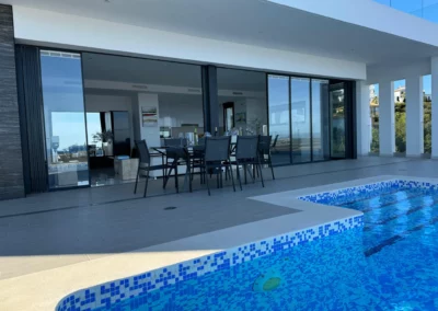 ultra slim sliding doors installation by a pool and sea