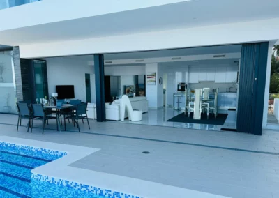 ultra slim sliding doors installation by a pool and sea