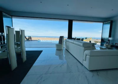 ultra slim sliding doors installation by a pool and sea