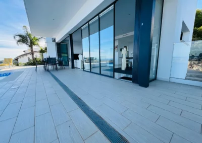 ultra slim sliding doors installation by a pool and sea