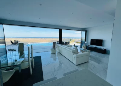 ultra slim sliding doors installation by a pool and sea