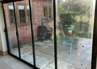 Ultra slim sliding doors by a patio. Vision Glass Doors