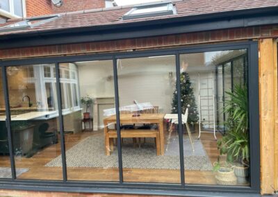 Minimal sliding doors by a patio. Brick home, UK