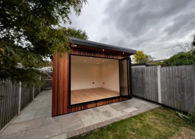 Ultra thin bi-folding doors by a patio.