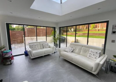 Ultra thin frame concertina doors letting lots of light into a living room in the UK