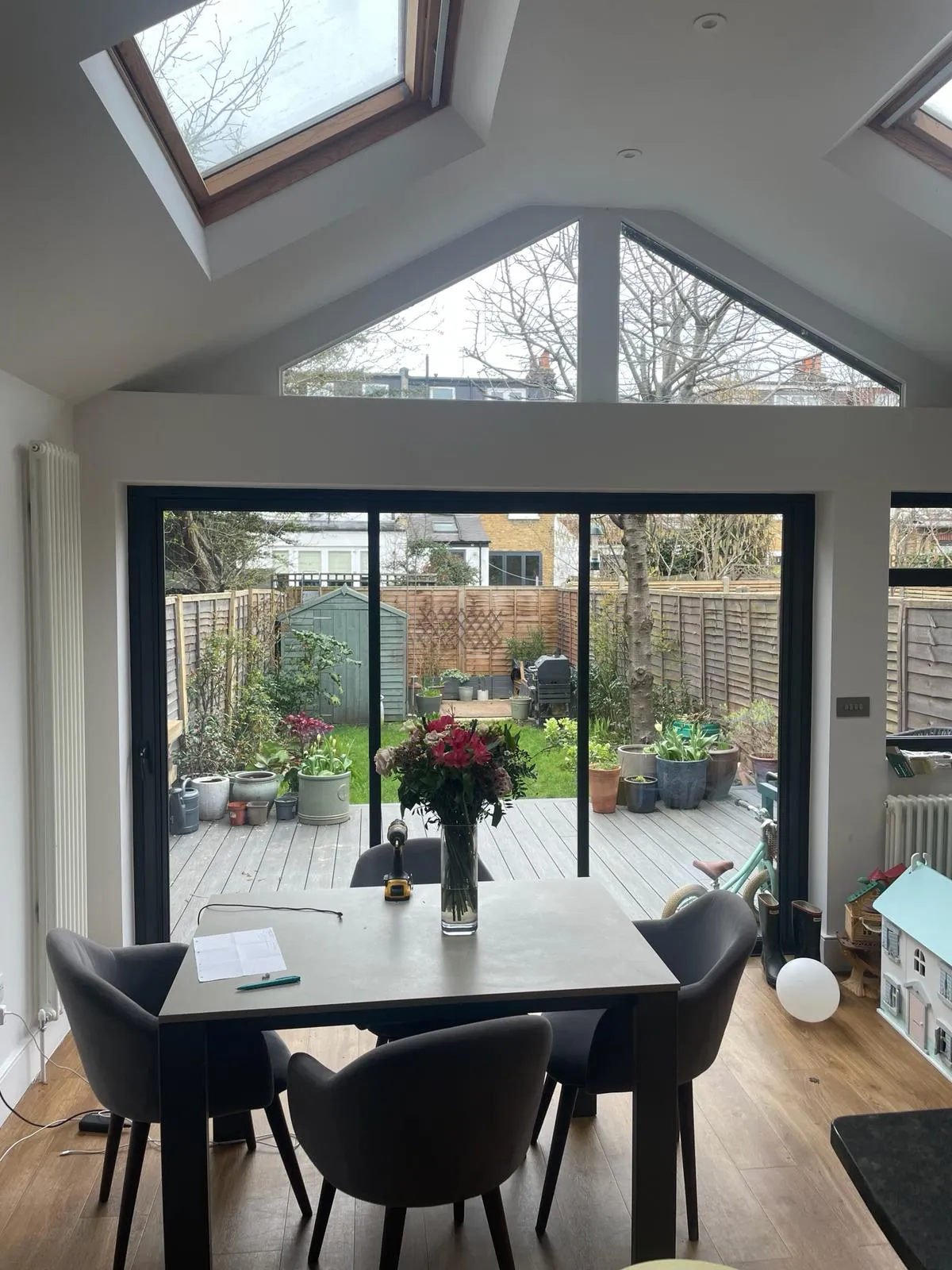 Minimal glass doors installed in a kitchen extension in the UK. Black minimal aluminium frames.