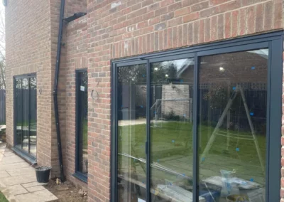 Ultra slim sliding glass doors being installed