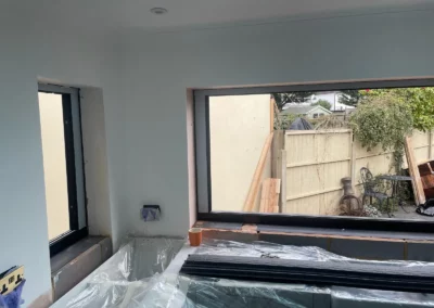 Ultra slim sliding glass doors being installed in the UK