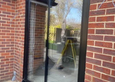 Small thin frame sliding doors, brick home in the UK