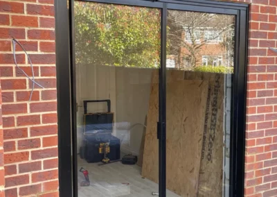 Ultra slim glass sliding doors, brick home in the UK