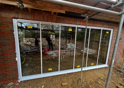 White bifold doors being installed