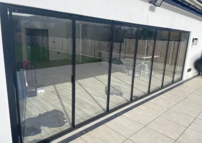 Frameless slide and turn patio doors