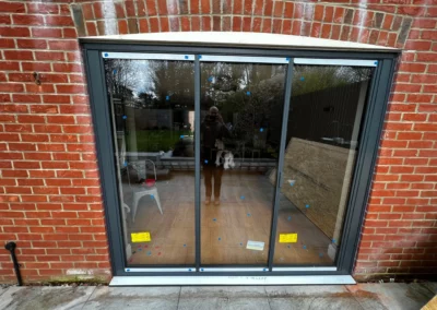 Ultra slim bifold patio doors, brick home