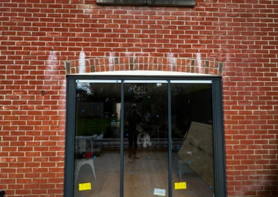 Bifold patio doors, brick home