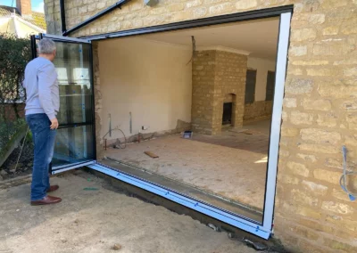 Ultra slim bifolding doors by a patio. Home, UK