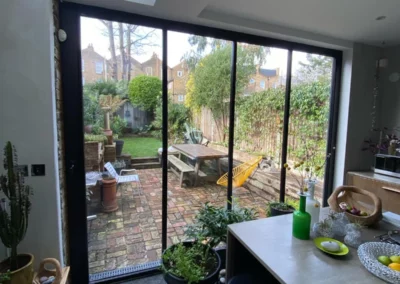 Garden views from dining area with ultra slim bifold doors