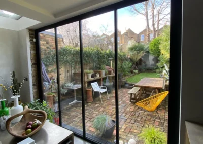 Garden views from dining area with ultra slim bifold doors