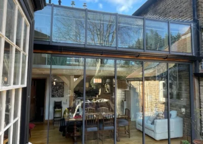 Ultra slim sliding doors letting in lots of light and giving panoramic garden views.