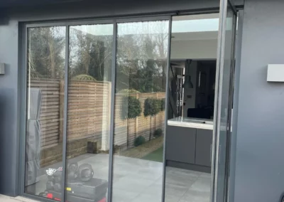 Trendy bifold glass doors with ultra slim frames by a patio