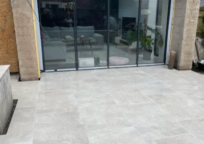 Trendy external sliding glass doors with ultra slim frames by a patio