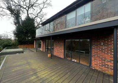 Ultra slim bifolding doors by a garden. Brick home, UK