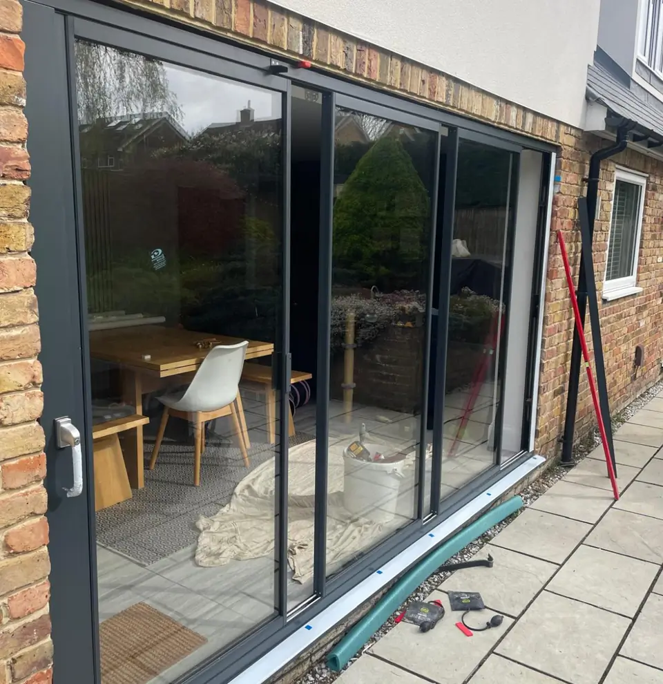 Thin frame sliding exterior glass panelled door installed in a UK home