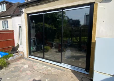 three panelled sliding glass doors