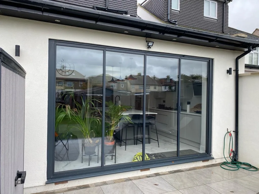 Anthracite Grey Bifold Doors: Buyer’s Guide 14 Anthracite grey patio doors (RAL 7016), with 4 panels