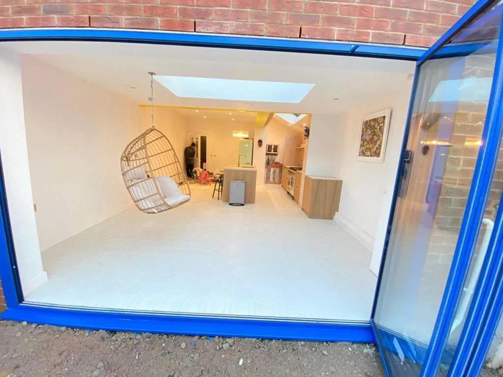 Bright blue patio doors that fully open all the way