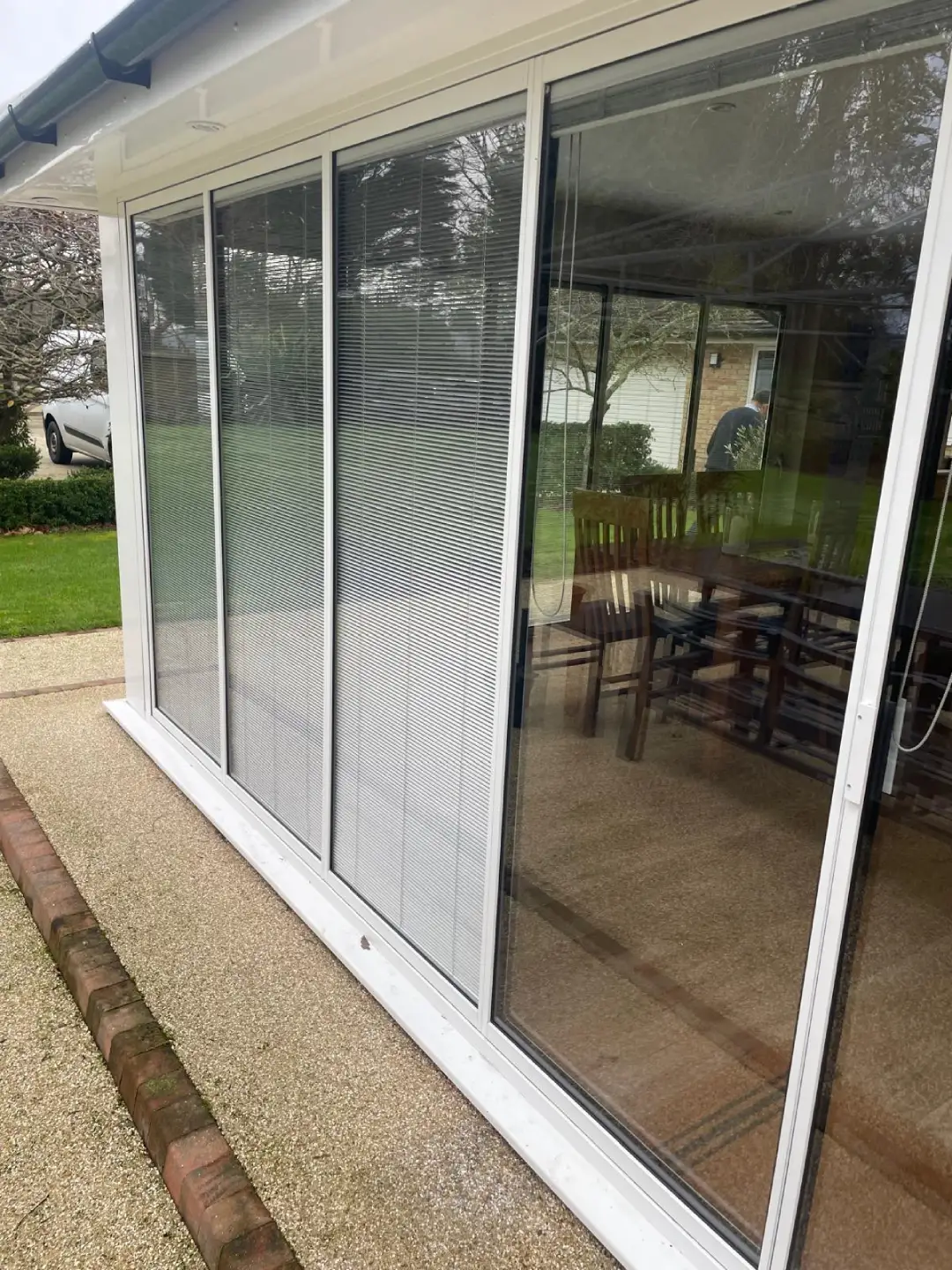white aluminium patio doors with blinds