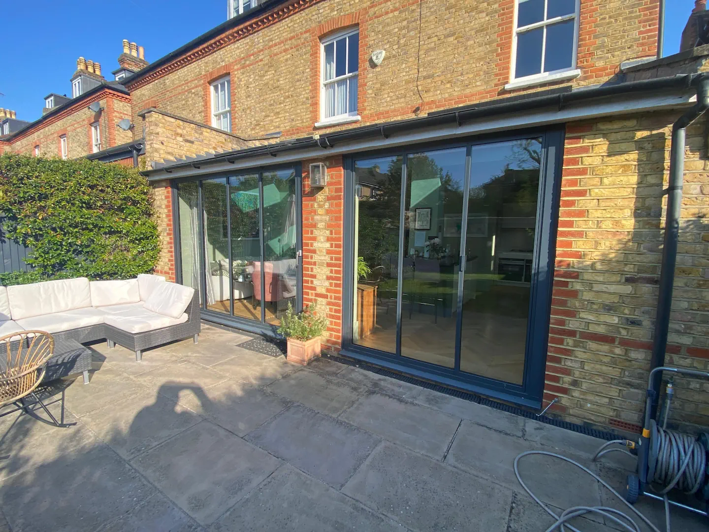 2 sets of dark grey bifold doors